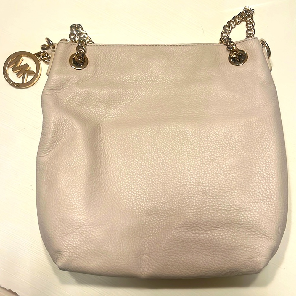 Cream colored, leather Michael Kors handbag.